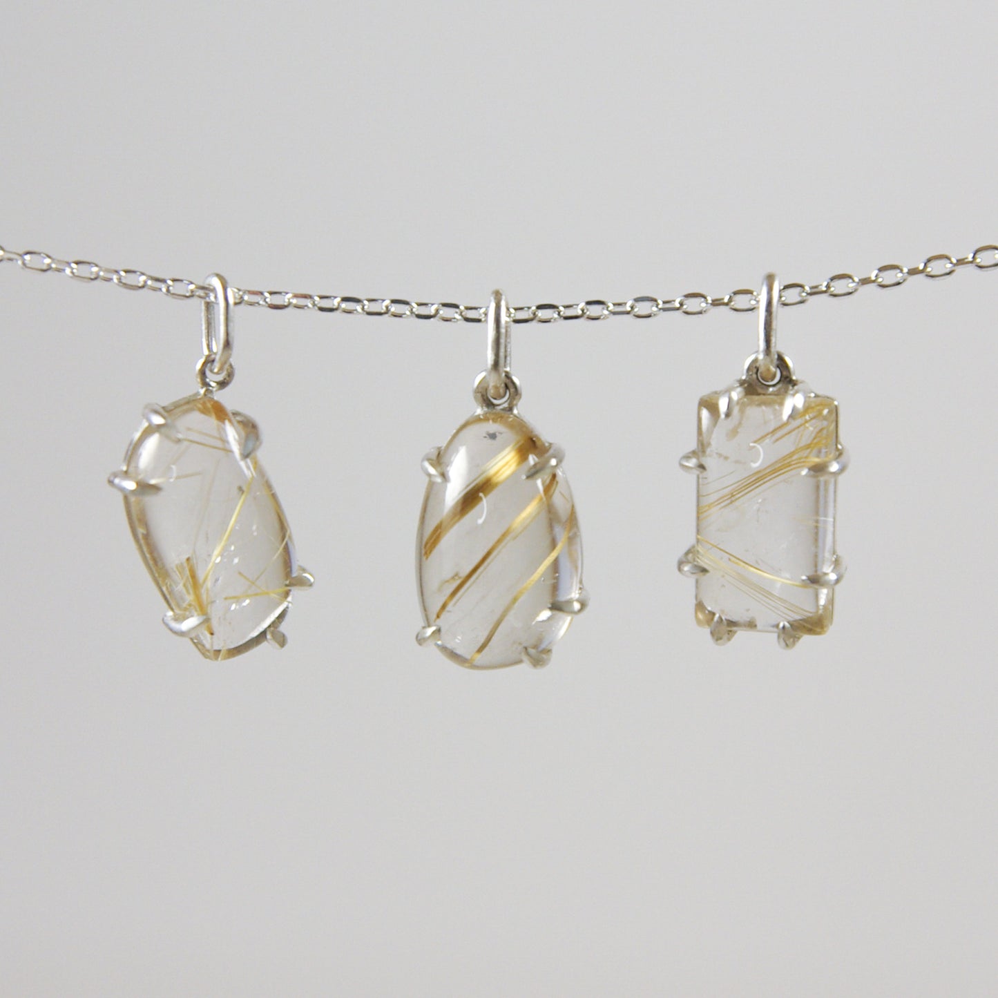 Pendentif asymétrique en argent 925 et quartz rutilé